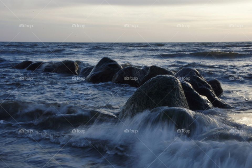 Waves over rocks