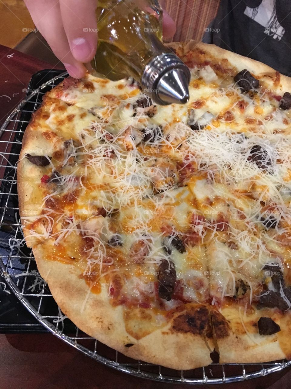 Lots of Meat Pizza drizzled with olive oil 