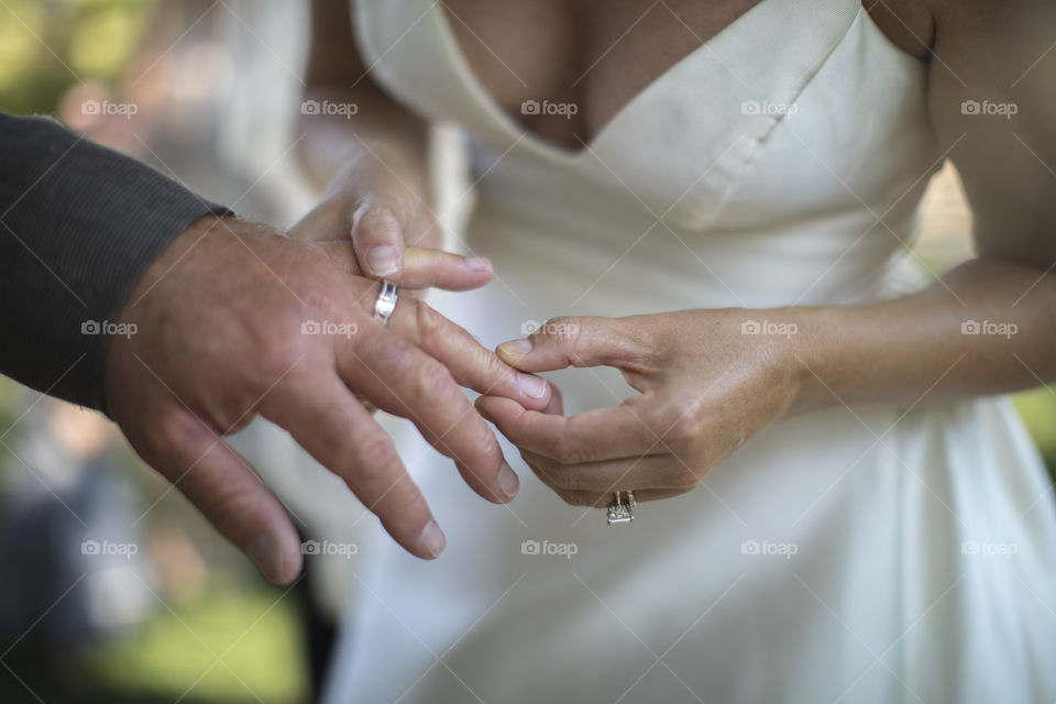 Woman holding the hand of her husband.