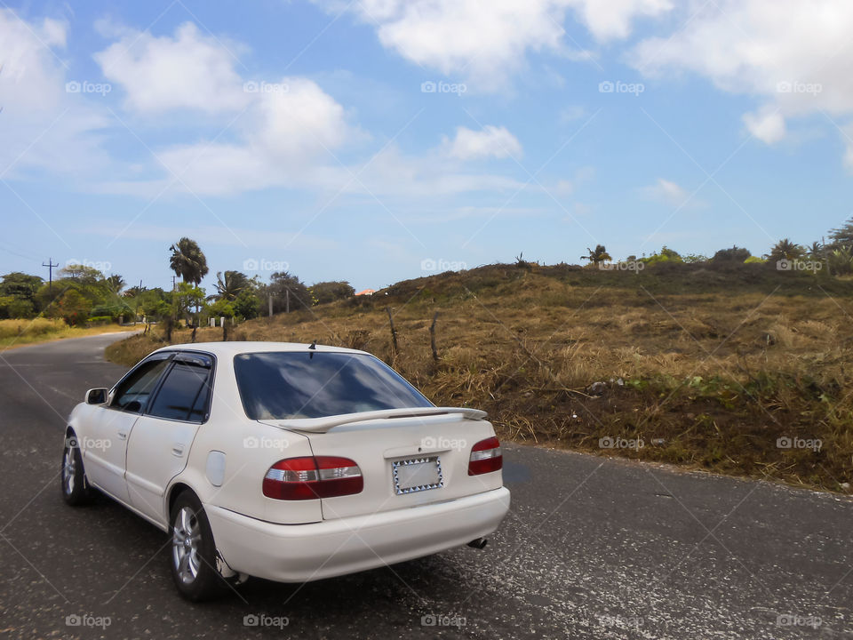 White Car on Lonely Road