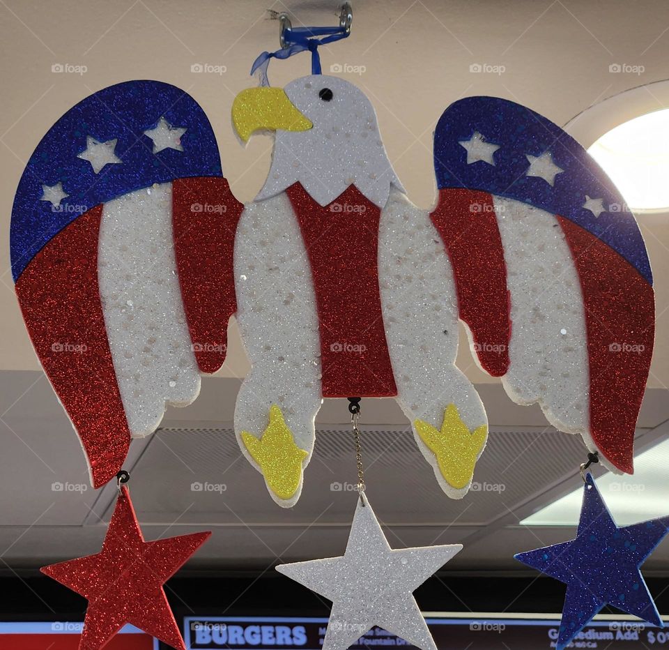 patriotic stars and stripes American eagle hanging decoration to celebrate Independence Day in a fast food restaurant