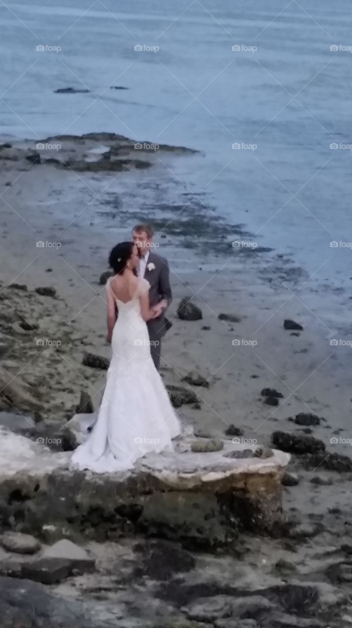 bride and groom on the beach. Mikey & Lolo's wedding