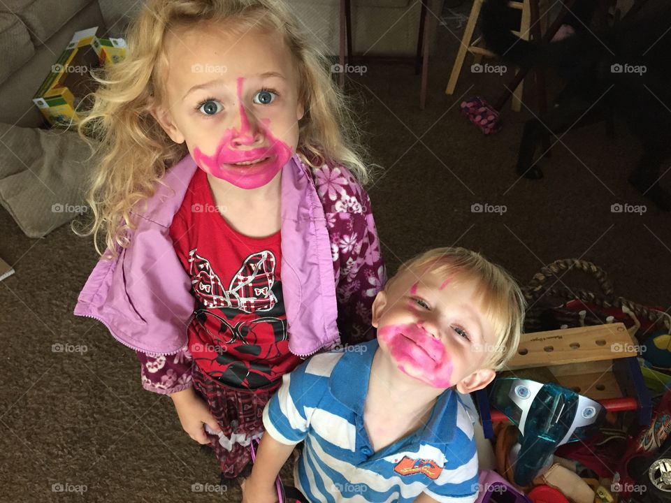 I thought they were too quiet!. A brother and sister who found mommy's pink lipstick!