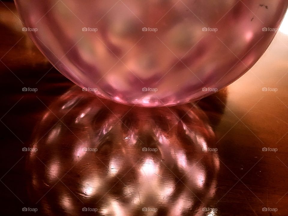 glass ball with light shining through creating a pattern