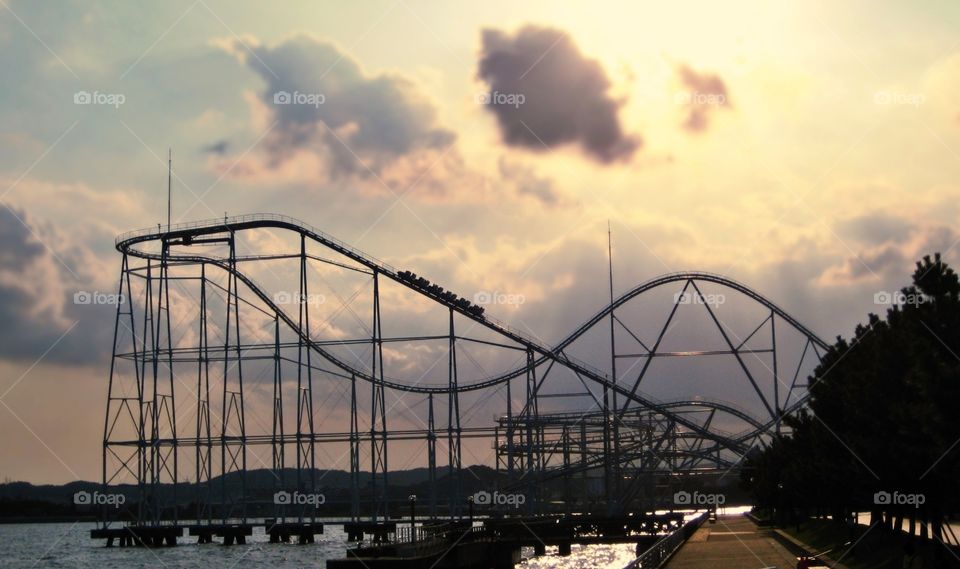 Roller coaster with a sunset sky at Sea Paradise - Japan