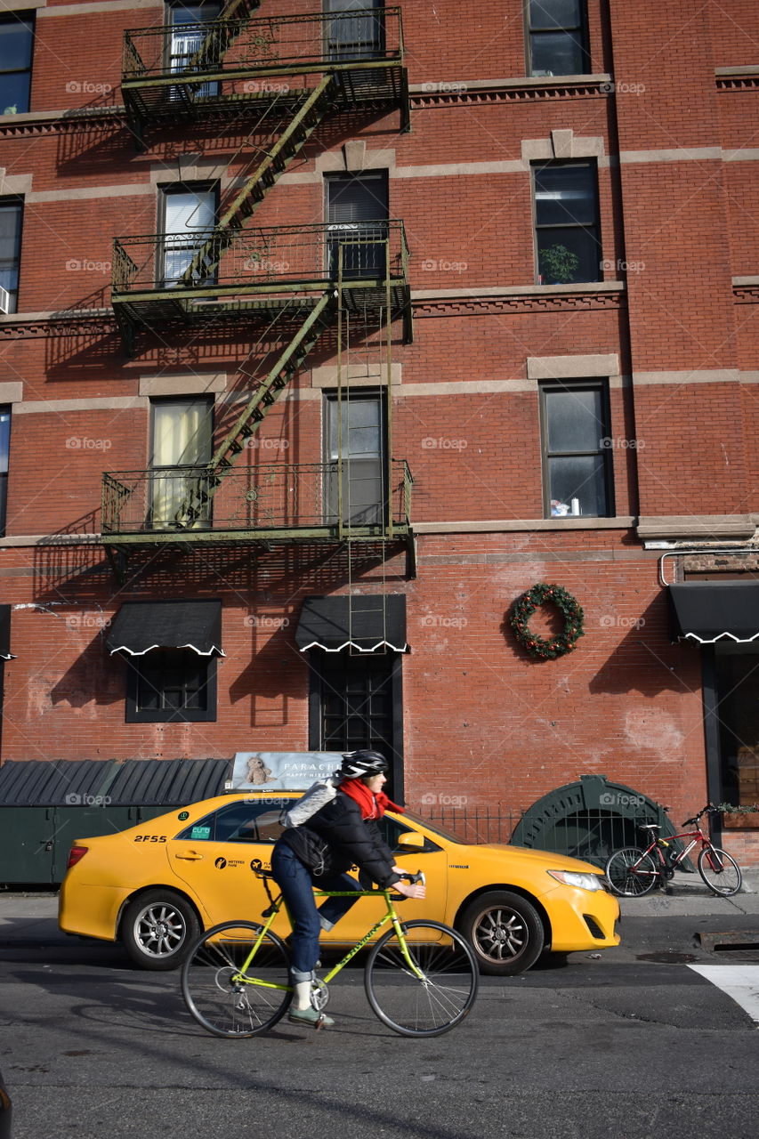 A bike and yellow cab 