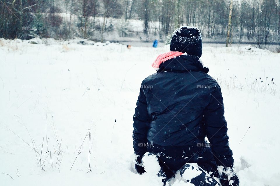 Girl sitting in the snow