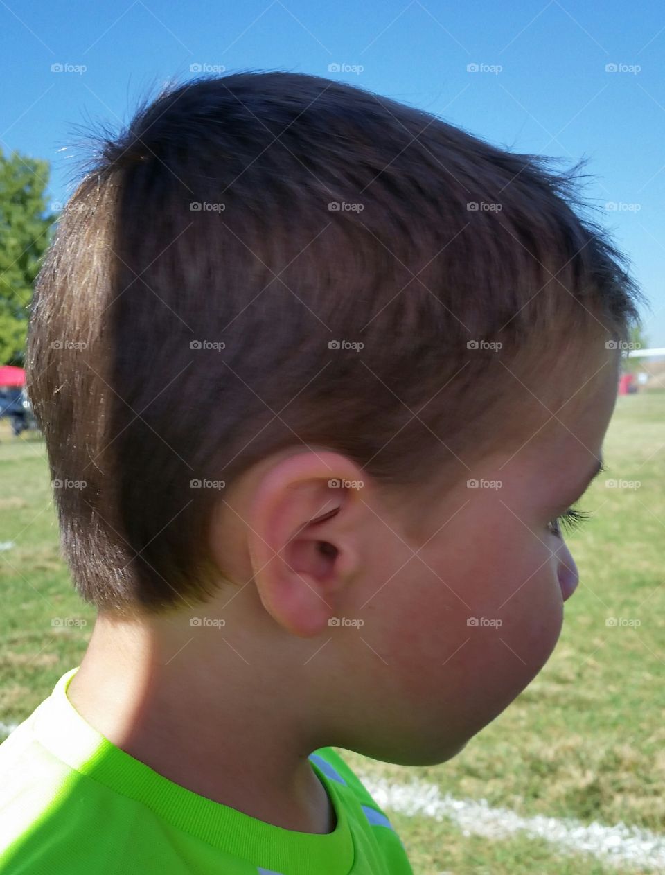 Profile of Little Boy. Profile of Little Boy mostly in the shade .