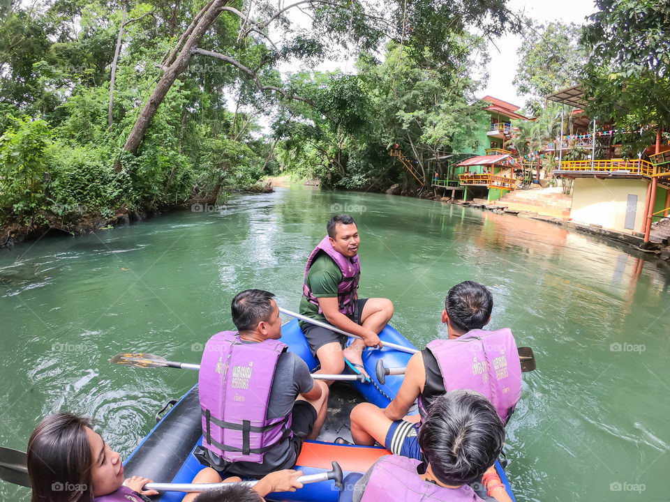 Tourists on the inflatable boat floating on the water in the river The flow of Kaeng Krachan Dam at Phetchaburi in Thailand. June 10, 2019