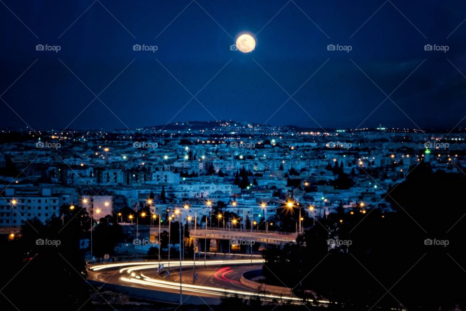 cityscape under moonlight