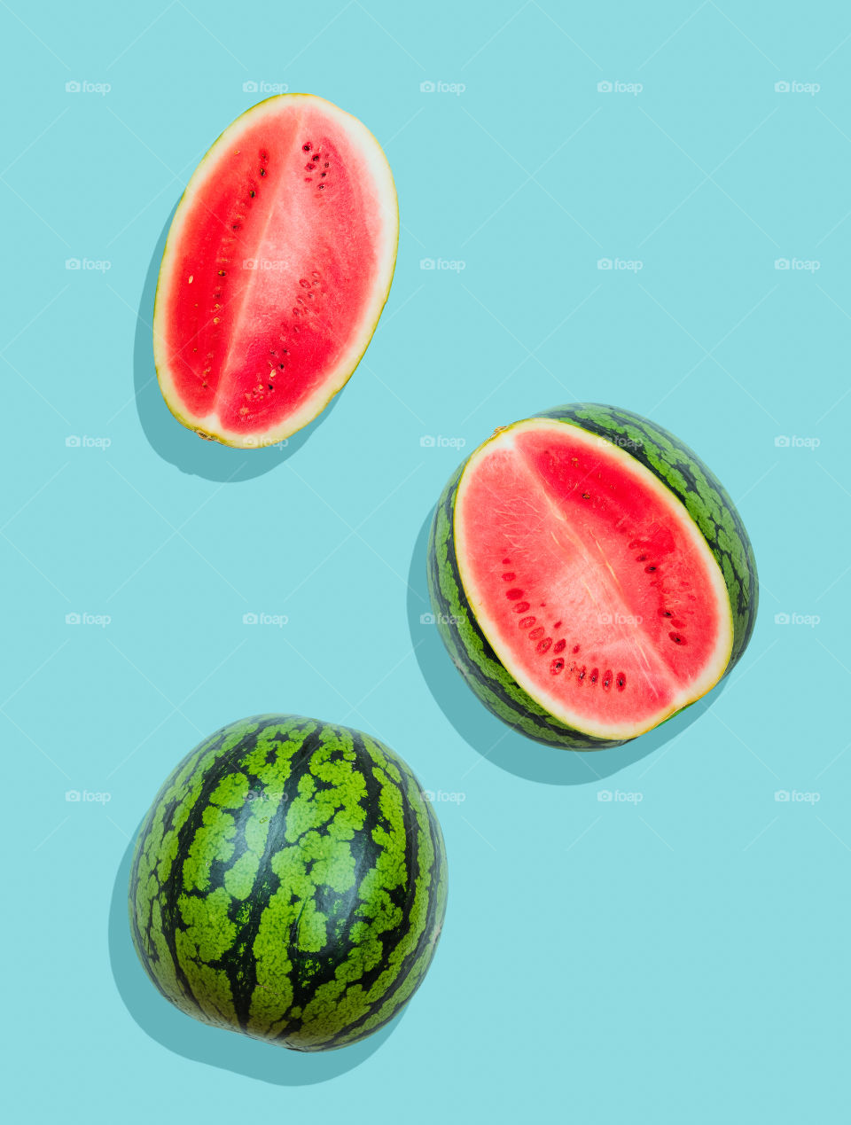 Pieces of watermelon on plain blue background