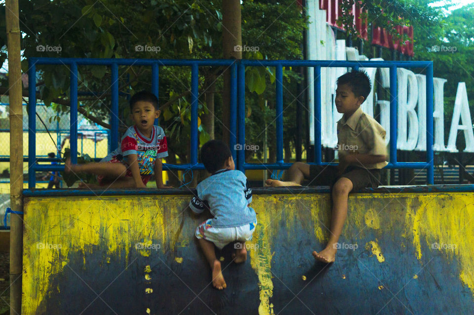 Children playing near railing