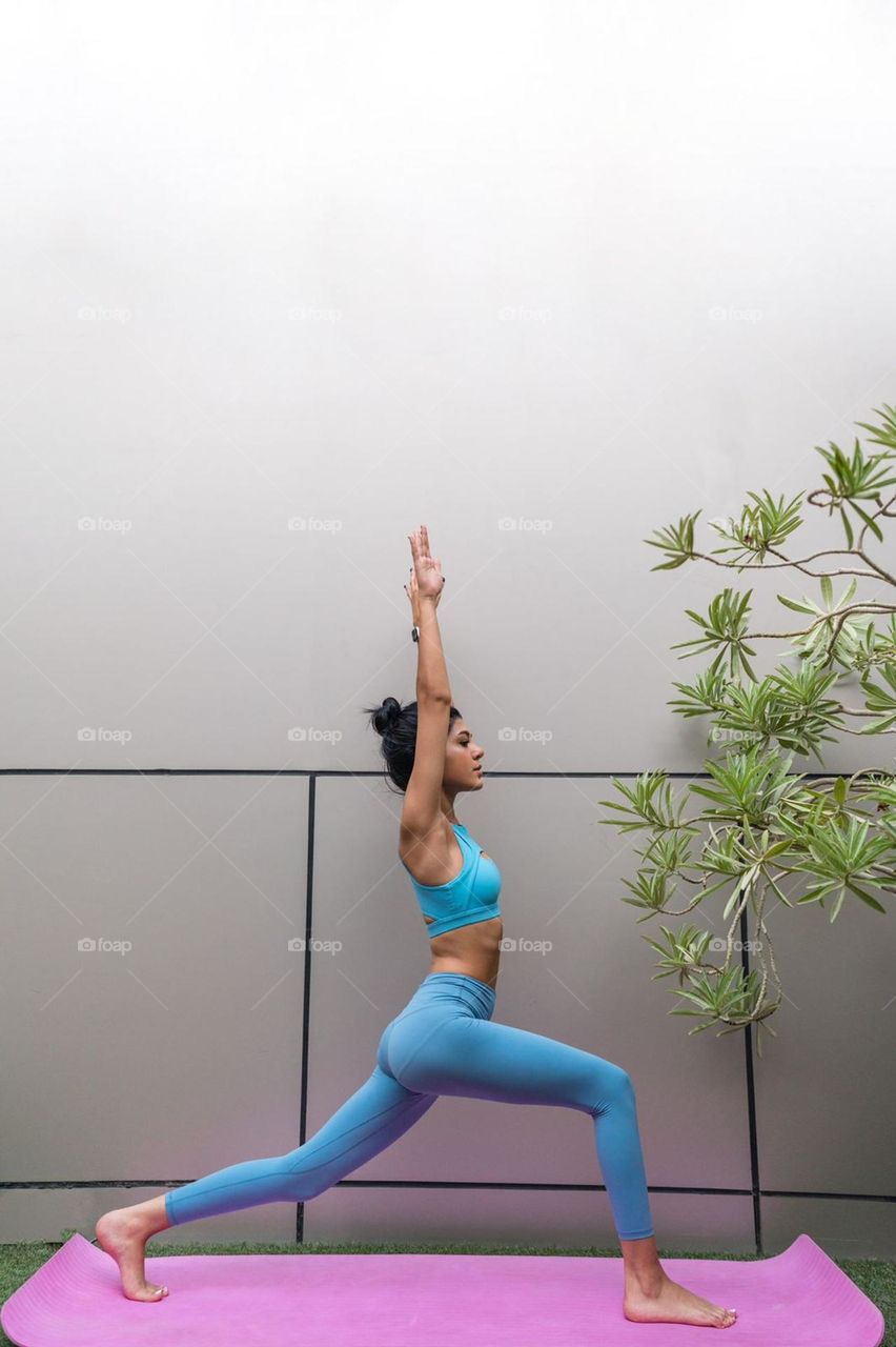 Woman exercising in the zen garden 