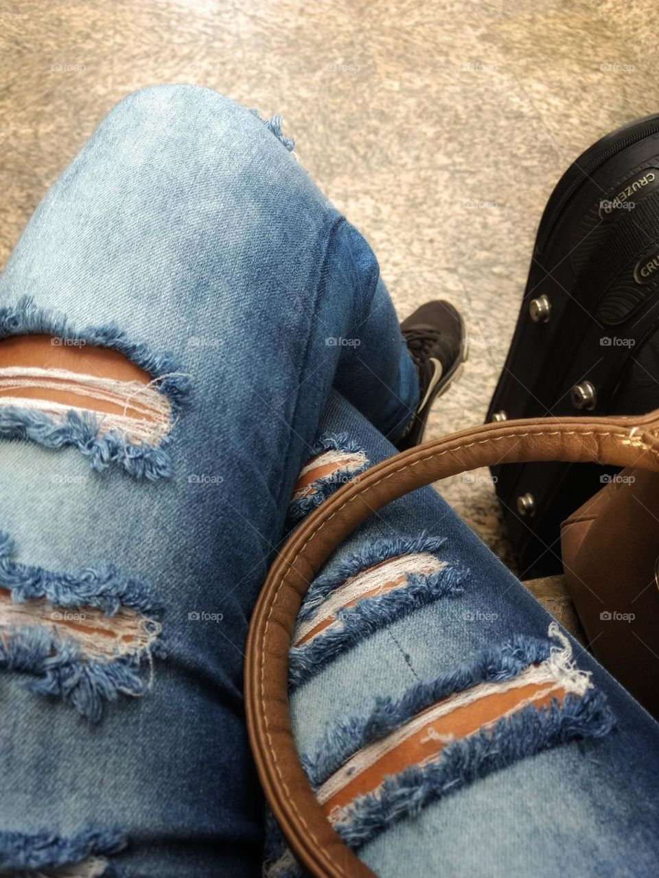 Nothing like taking a vacation.  Ripped jeans or not, and sneakers on your feet, well at ease, it's great to travel.