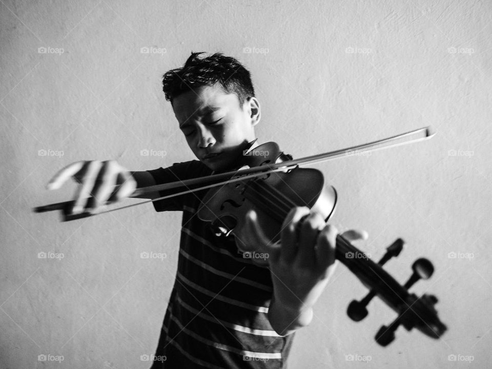 Violinist practicing at home