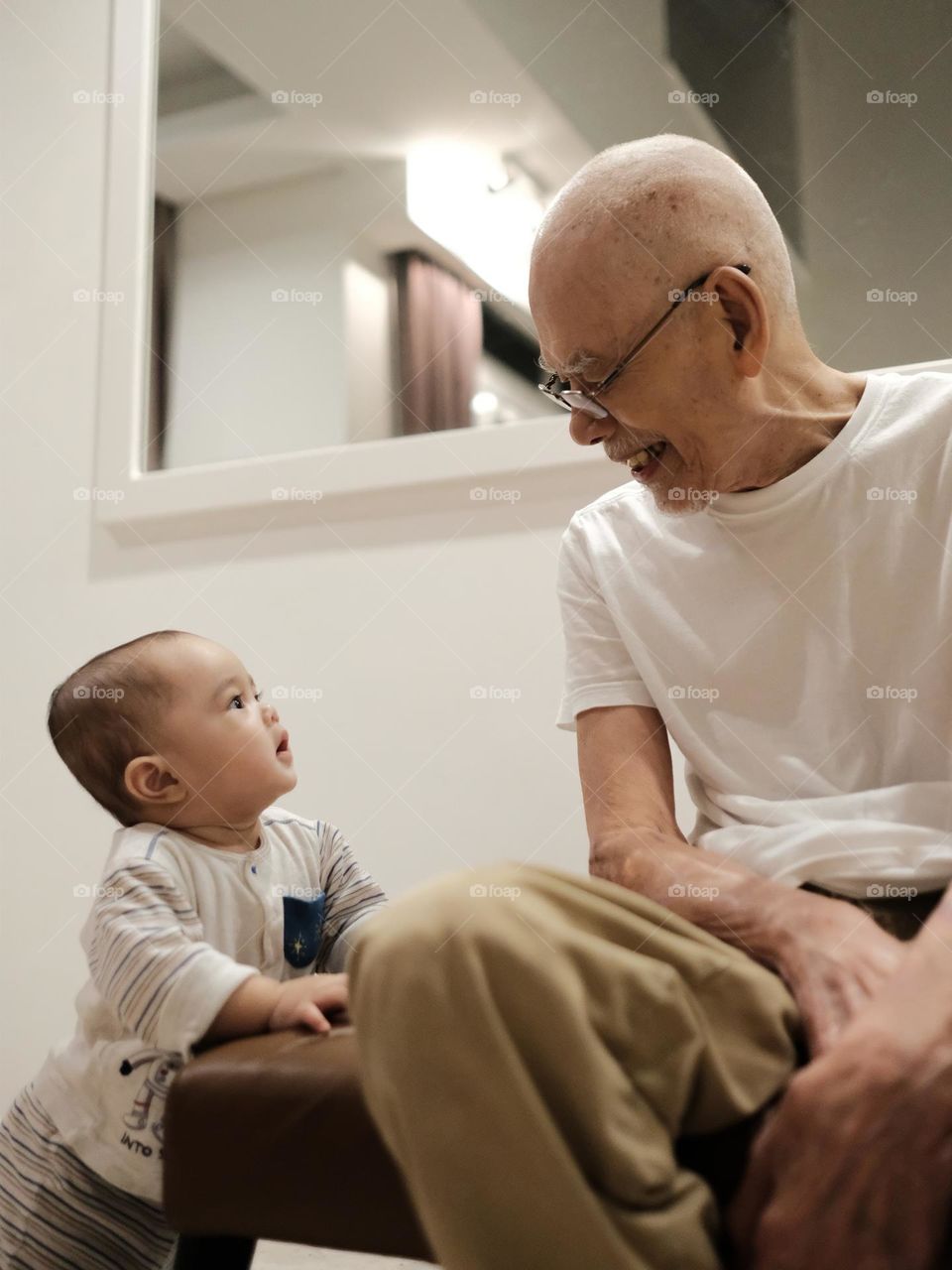 Great grandson interacting with great grandfather