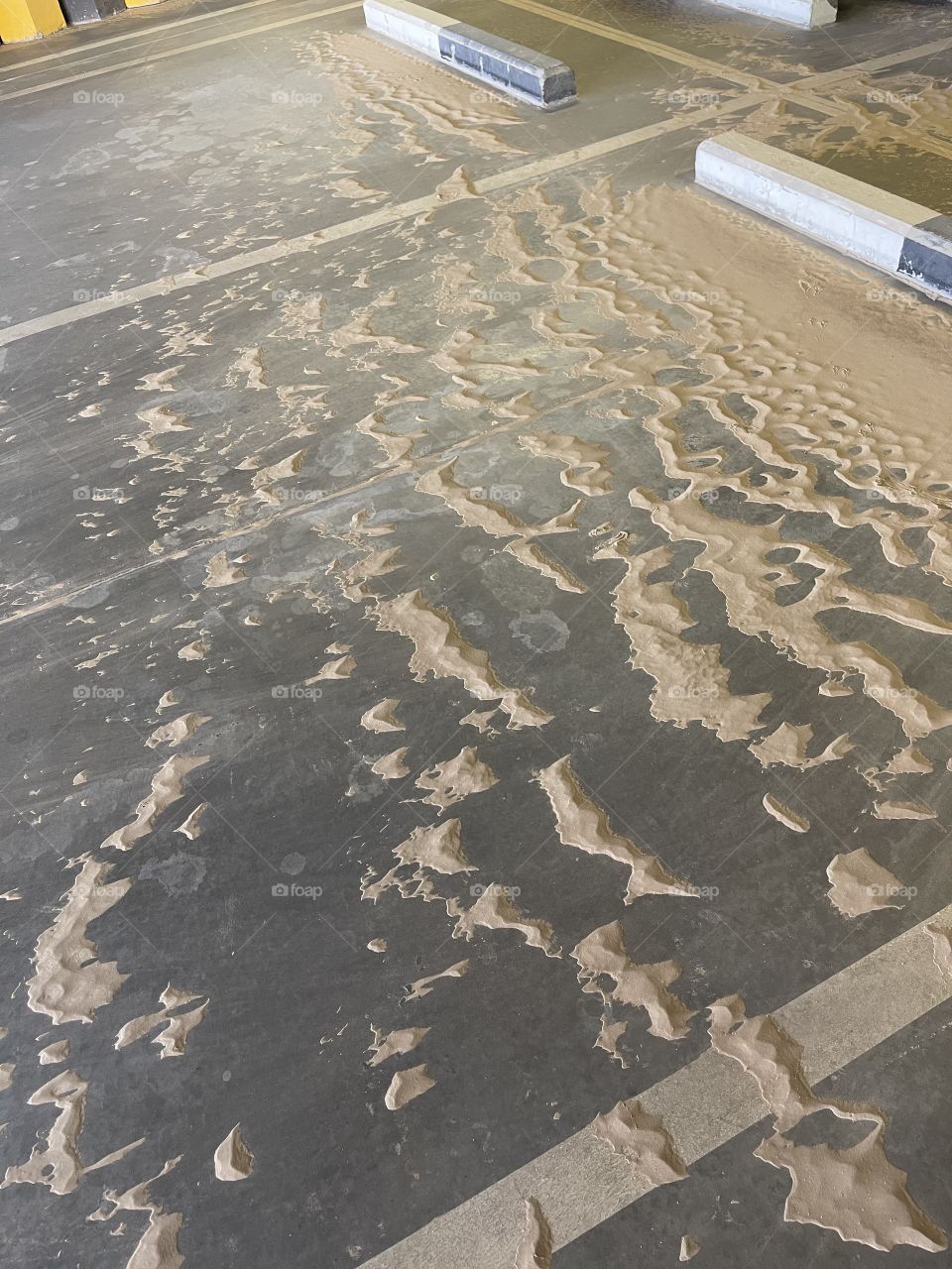 Tiny sand dunes in a car park