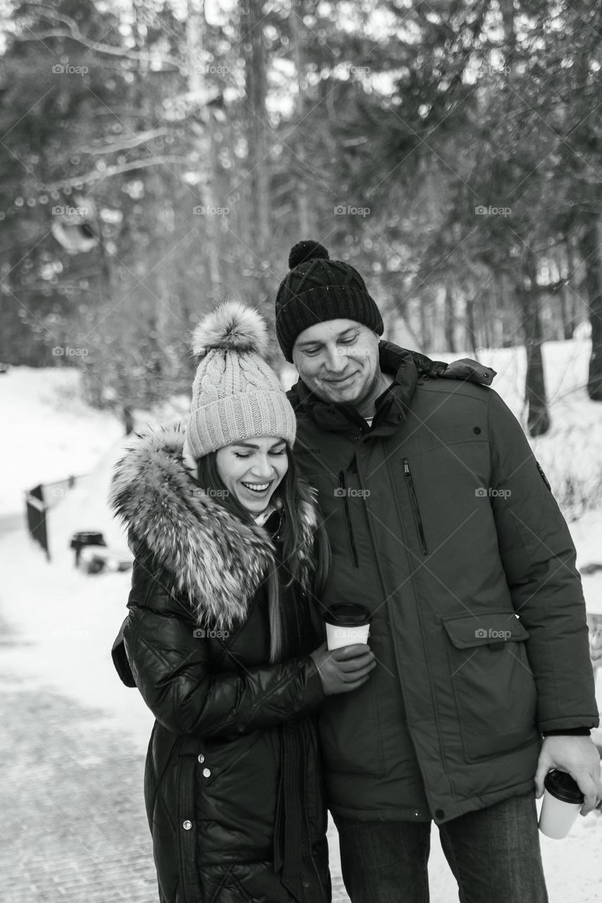 Happy couple in park winter season 