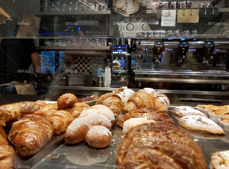 Bakery showcase with croissants and pastries