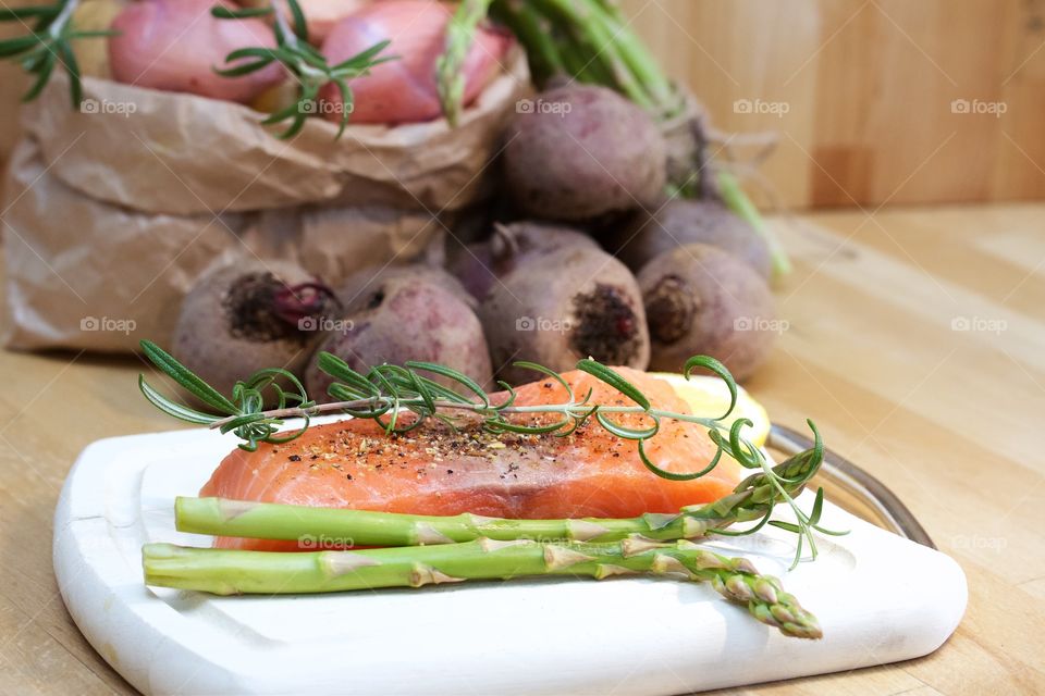 Salmon and organic vegetables on table