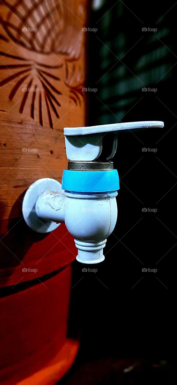 Clay filter and water faucet.