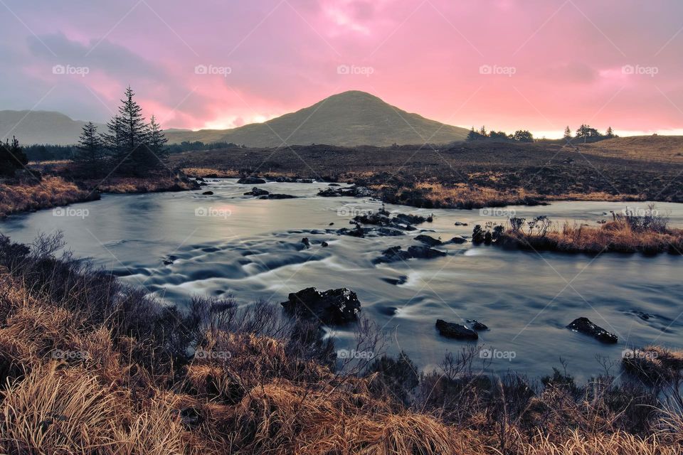 Baby pink sky at sunrise in Derryclare natural reserve in Connemara, county Galway, Ireland