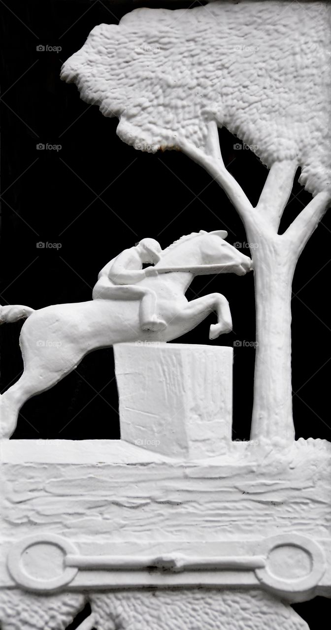 Saratoga Art. Wrought iron art of the steeplechase  thoroughbred jumping a fence. Black and white image of sculptured art
Fleetphoto
