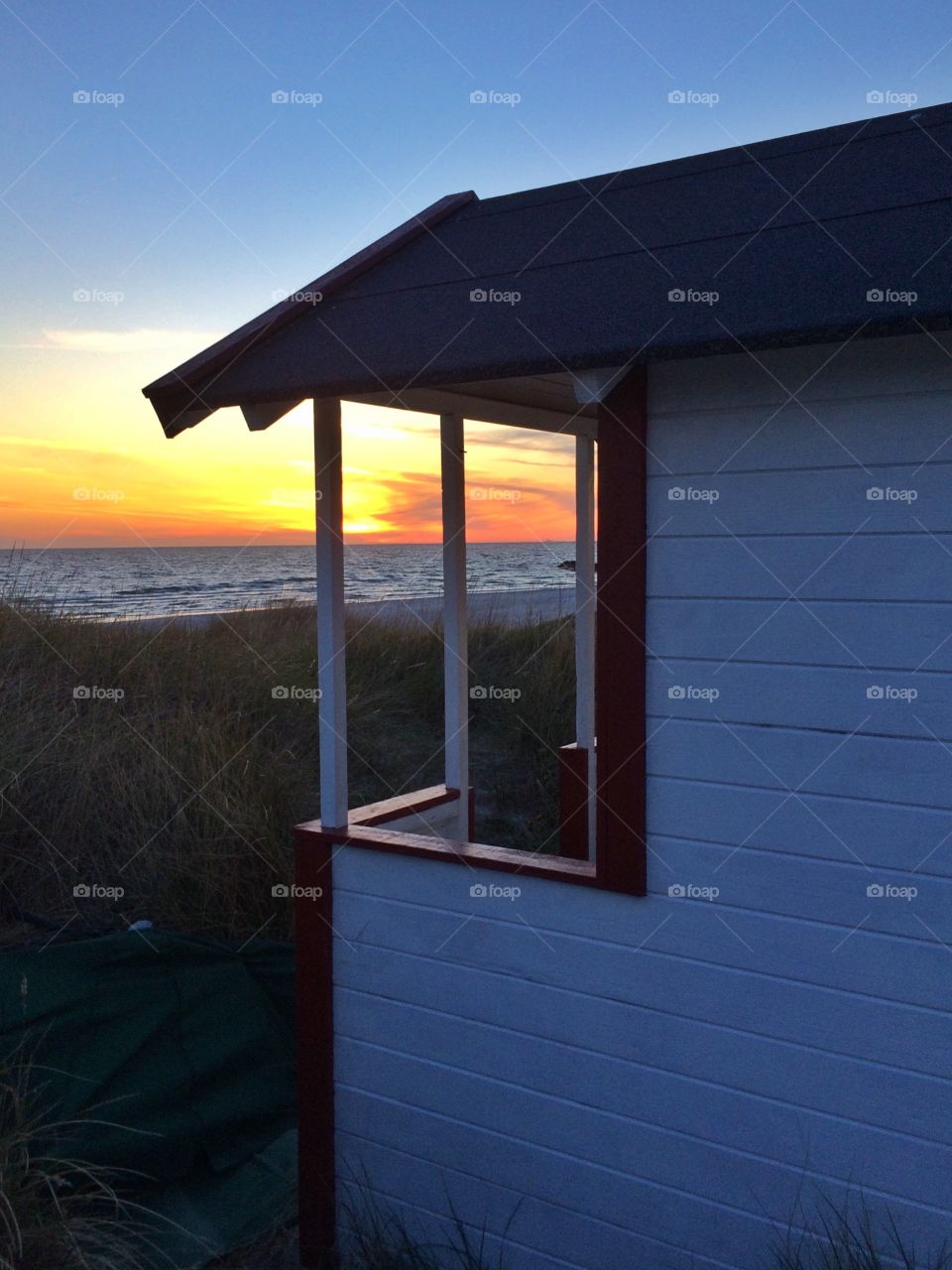 Beach hut in sunset