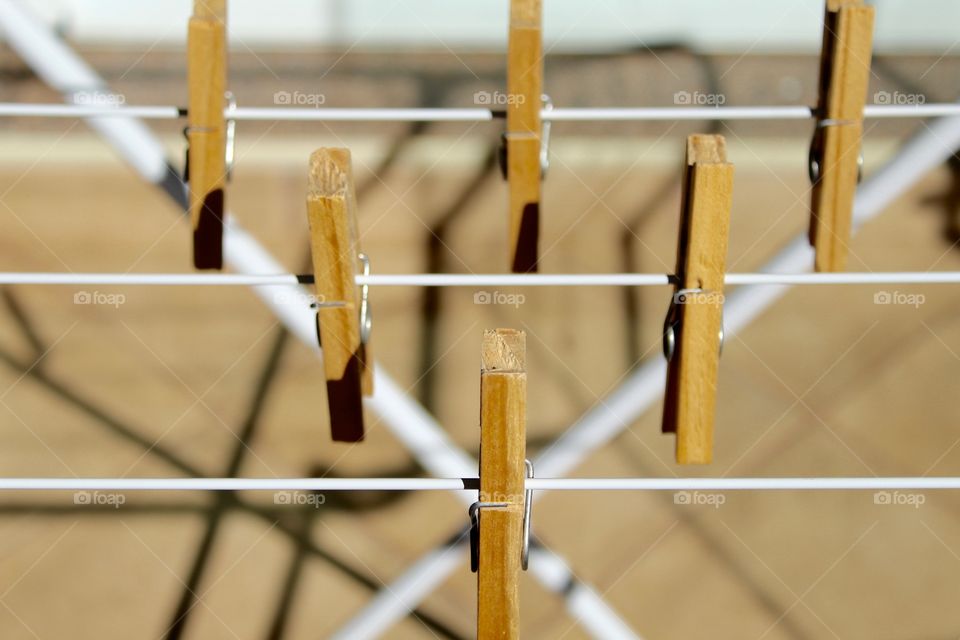 Wooden clothespins on the clothesline 