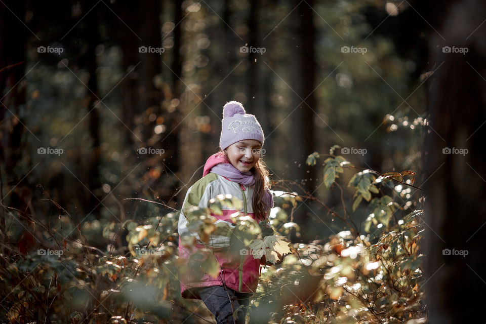 Little girl portrait in a rainy autumn day 