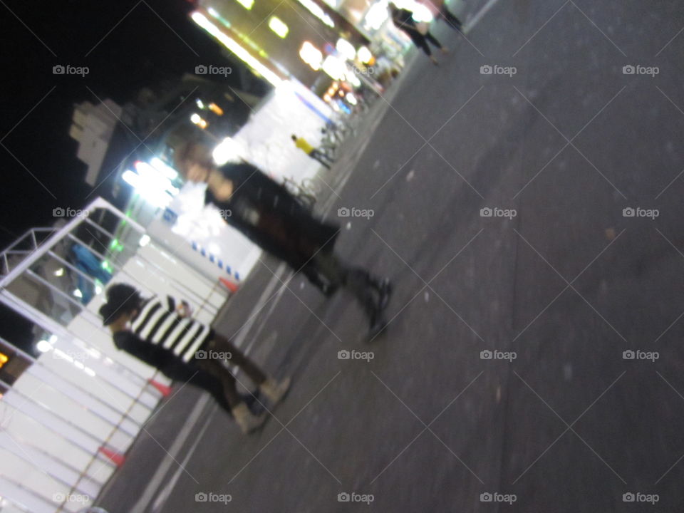 Young People in Kabukicho, Shinjuku, Tokyo, Japan.  Red light district. Host boys and fashionable girls out for the night.