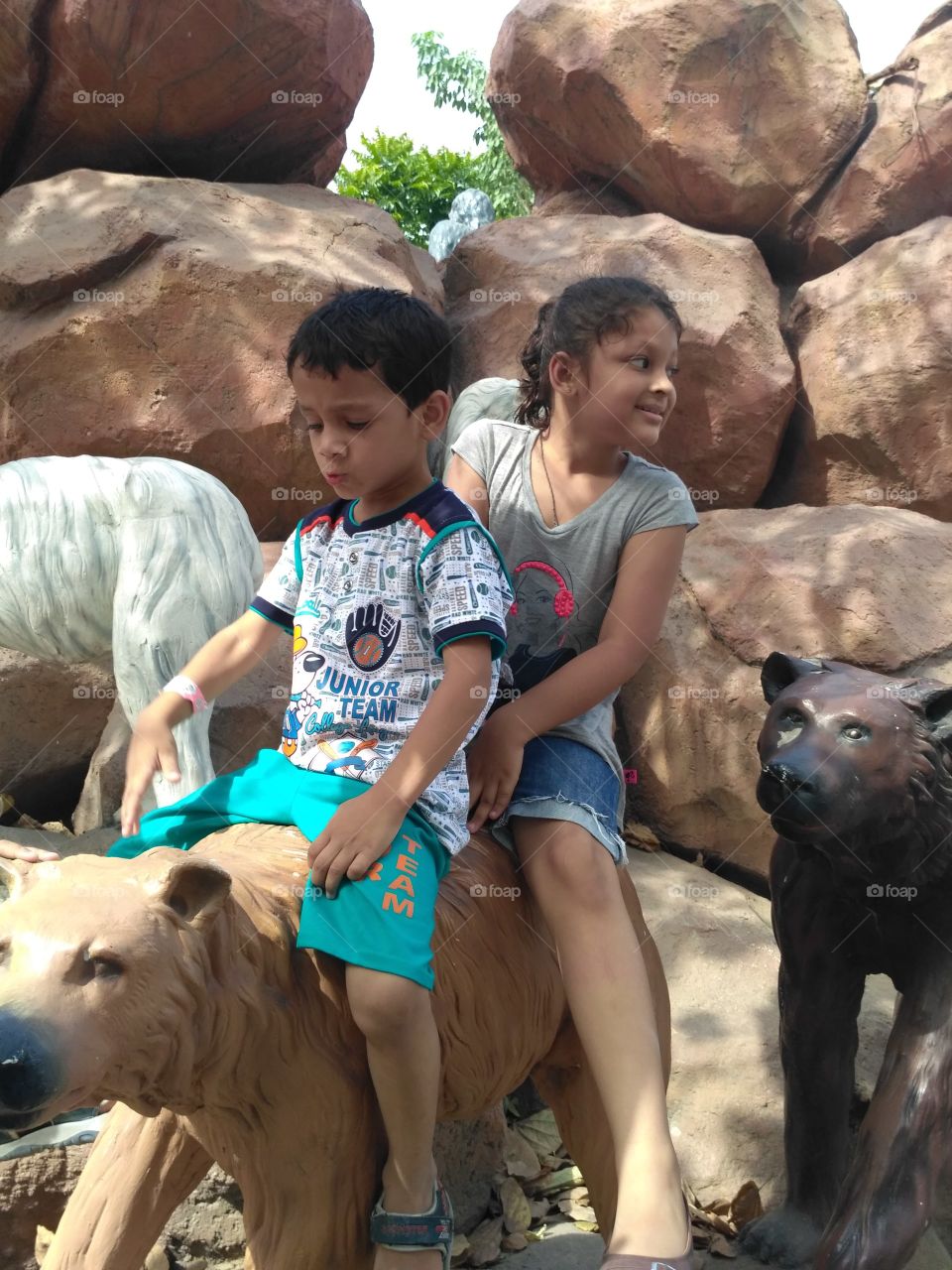 Children enjoying with animals