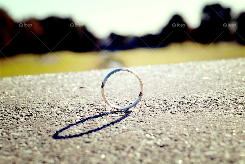 A wedding band stands in profile.