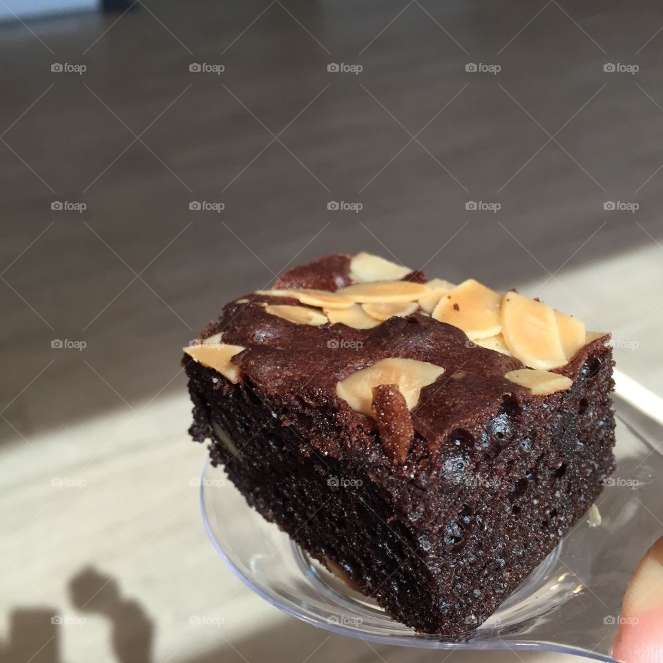 Chocolate brownie with nuts on background great for any use.