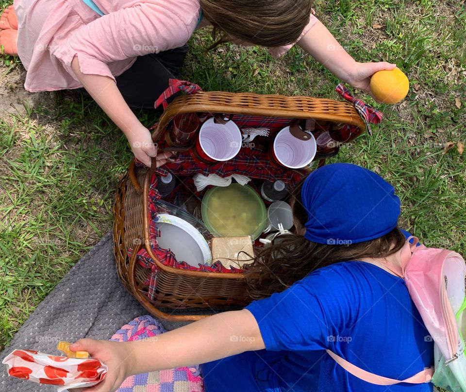 Picnic Basket Opened Up With Food And Items Needed For The Picnic Meal As A Family With Our Girls Excited To Grab What They Want To Eat First.