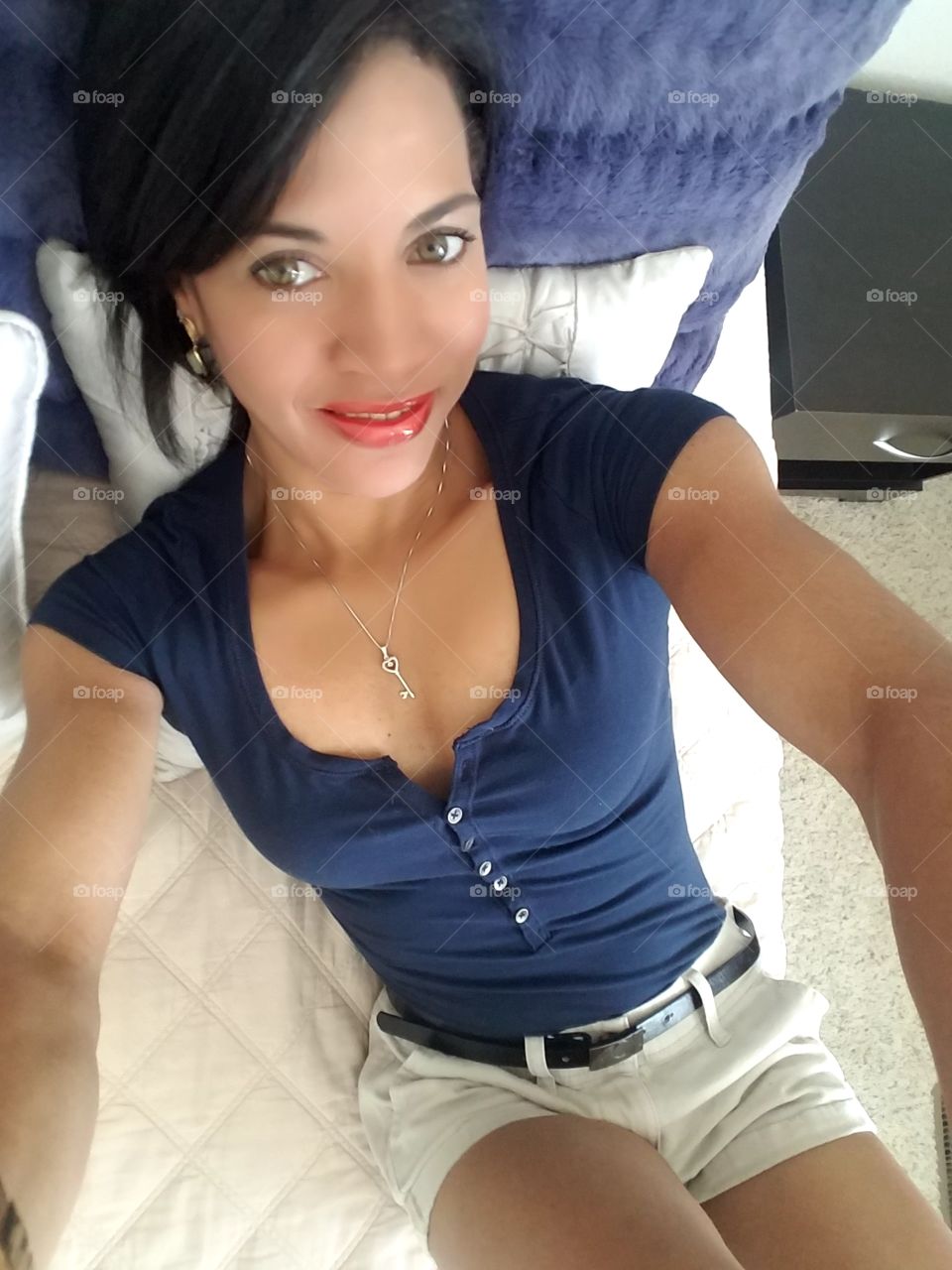 Portrait of woman lying on bed