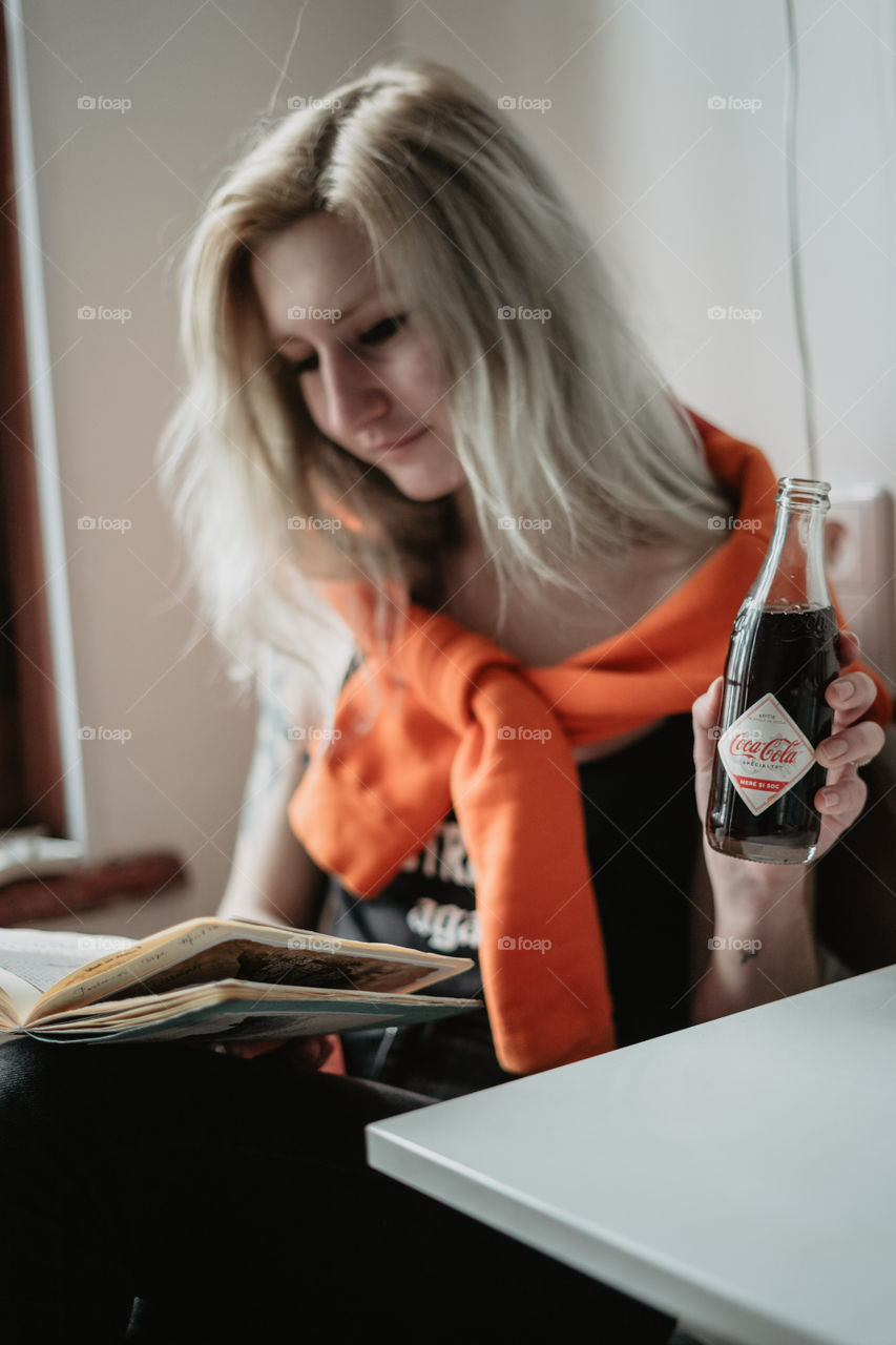 blond girl chilling with coca cola