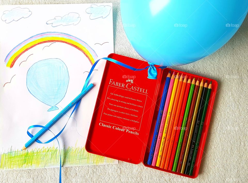 Painting of rainbow and balloon which became real with the help of the magic pencils