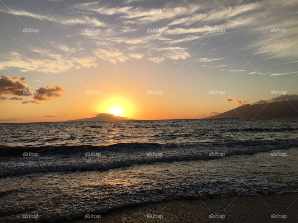 View of calm sea at sunset