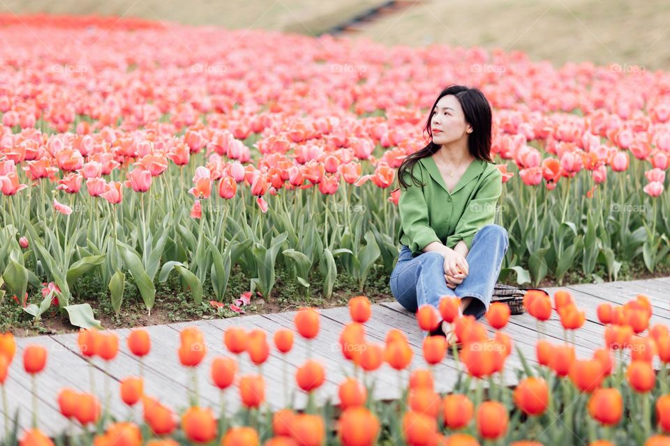 Beautiful Asian woman and tulips 