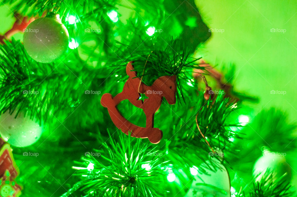 Christmas tree decoration element with red wooden horse 
