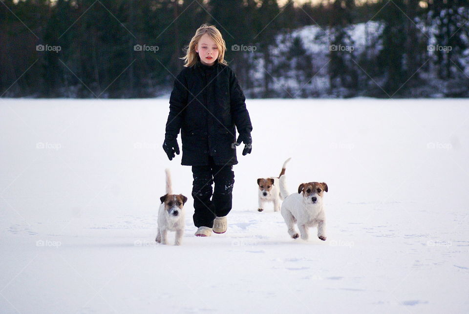 Girl walking in winter with dog