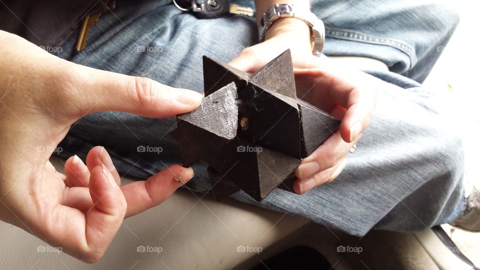 Hands at Work. Solving a puzzle