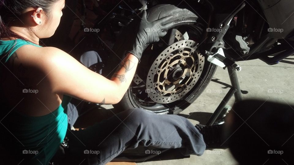 changing my tire. changing my front tire