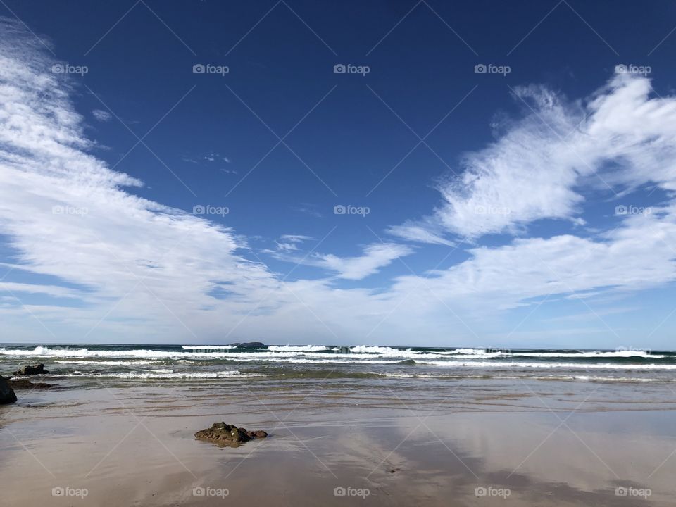 Emerald Beach New South Wales AUSTRALIA beach landscape near Coffs Harbour blue sky and calm surf