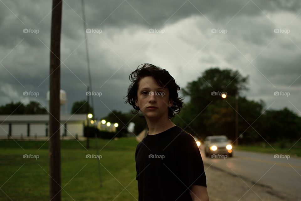 wind blows Thomas' hair back as the cold front comes in with the storm