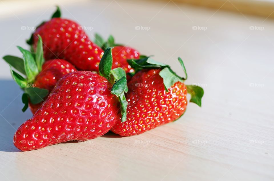 Red ripe strawberry on table