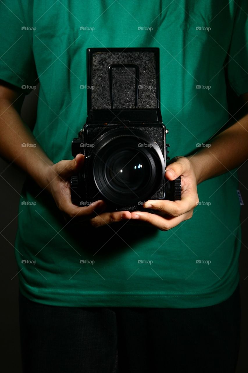 Man holding a medium format film camera
