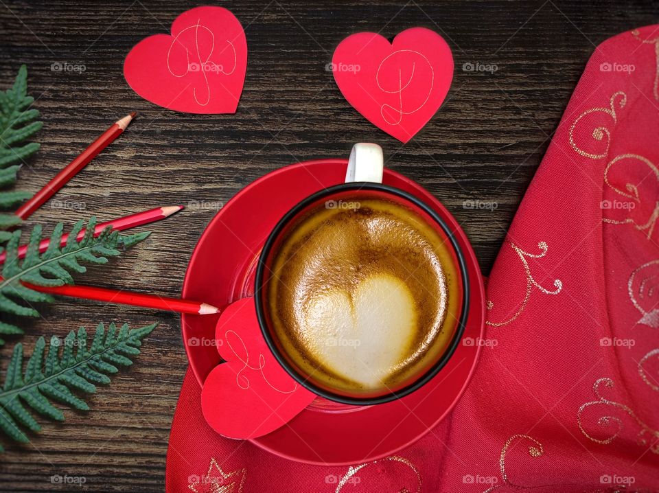 Red mug and paper hearts