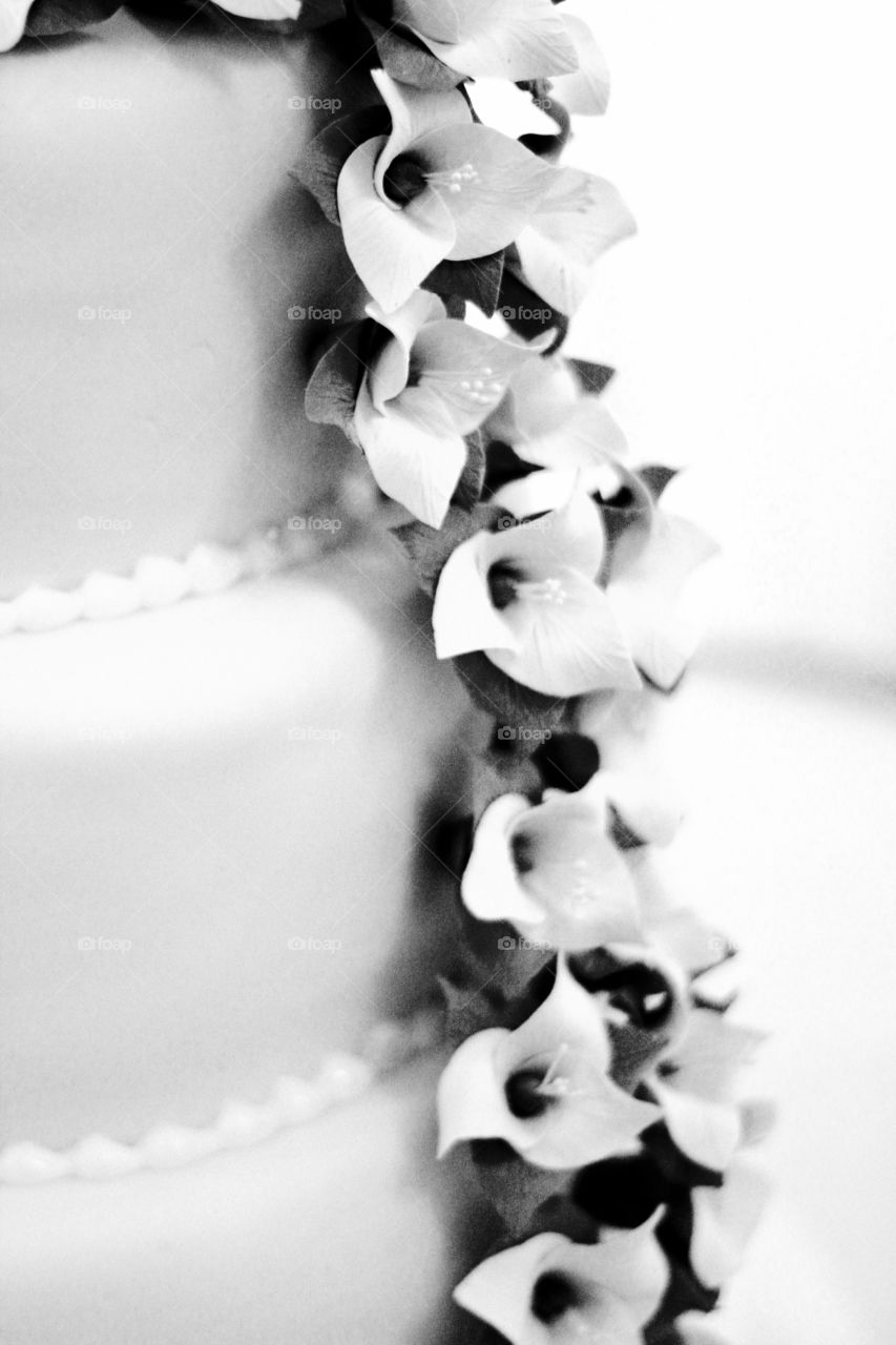 Black and wife photo of a floral white wedding cake